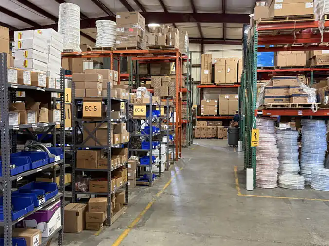 Warehouse shelves stocked with plumbing supplies at Hajoca Knoxville